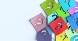 Sticky notes of question marks on different colored paper