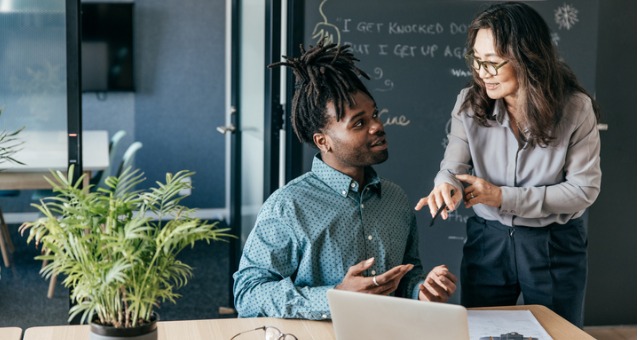 College student discussing career competency with instructor