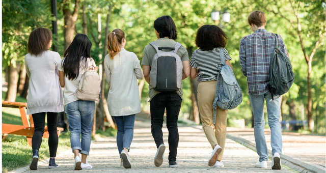 Five students walking to their first day of classes together.