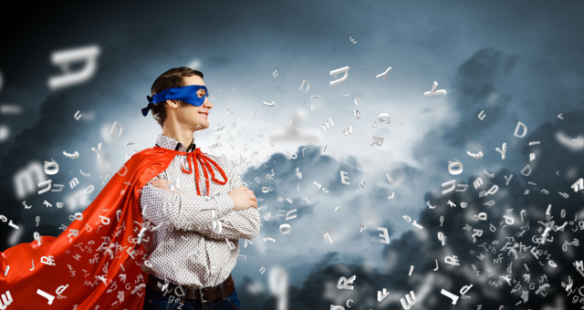 Superhero in a red cape and mask with letters flowing all around him