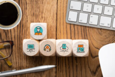 components of digital learning as icons on cubes on wooden background