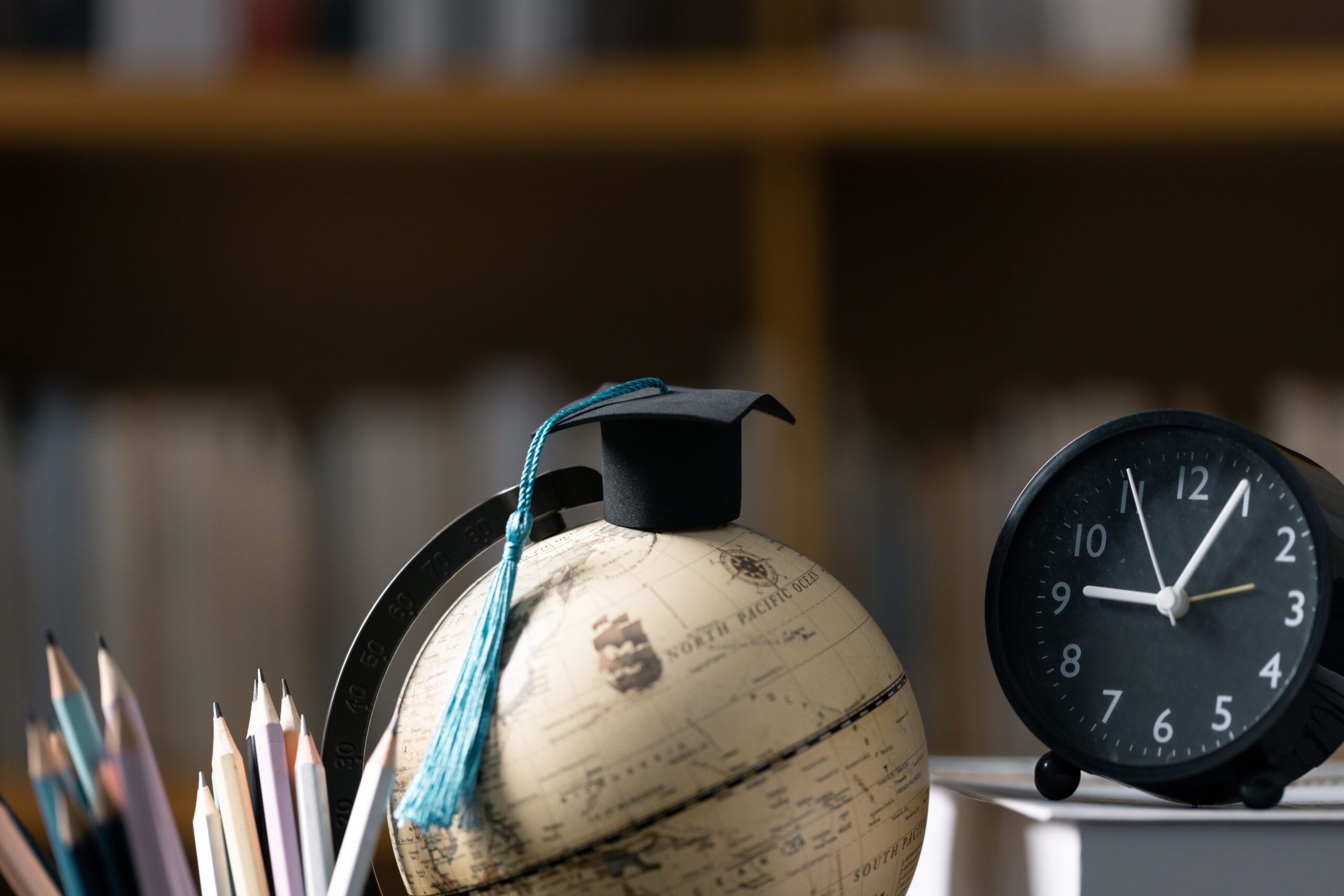 Graduation cap with Earth globe. Concept of global business study, abroad educational, Back to School. Education in Global world, Study abroad business in universities in worldwide. language study