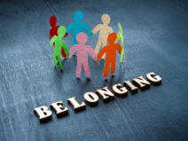 Paper men and the word belonging.