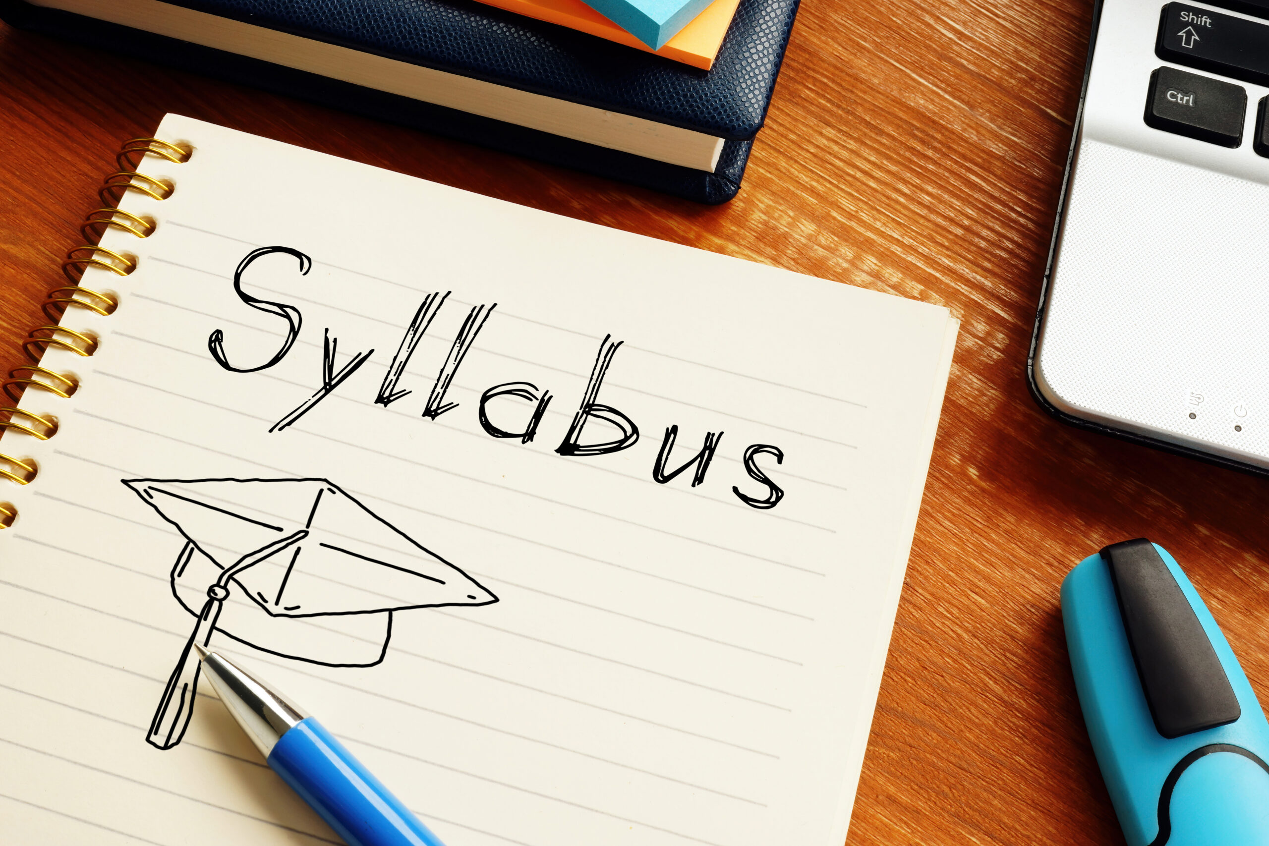 Syllabus is shown on a conceptual photo using the text