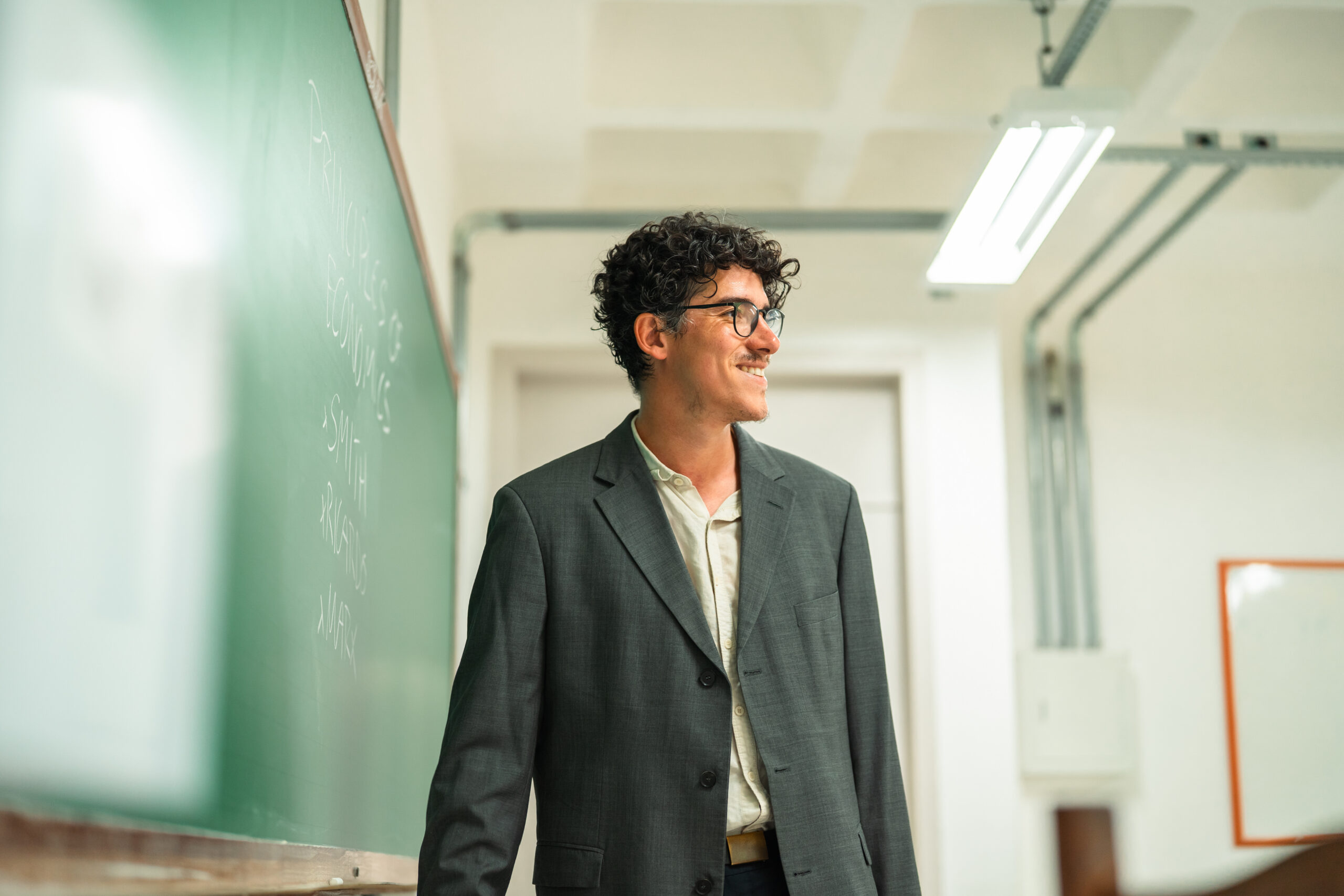 New faculty, university professor teaching in a classroom
